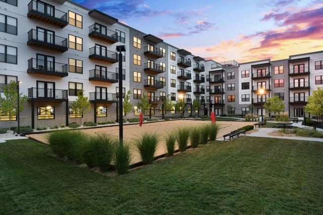 Apartment building volleyball court benches exterior at T-H-E Griff in Columbus Student Accommodation