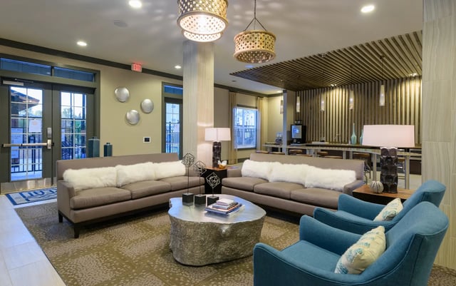 Sofa, chairs, coffee table, bar living room at The Retreat at Corvallis in Corvallis Student Accommodation