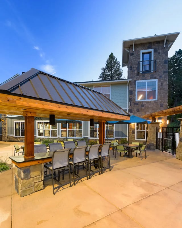 Bar with stools and tables outdoor common area at The Retreat at Corvallis in Corvallis Student Accommodation