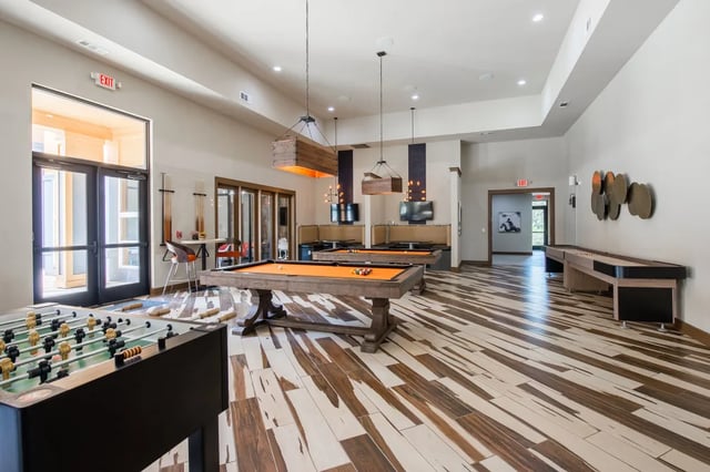 Foosball table pool tables shuffleboard playing area at The Quarters at Stillwater in Stillwater Student Accommodation