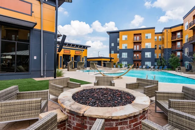 Fire pit chairs swimming pool exterior at The Quarters at Stillwater in Stillwater Student Accommodation