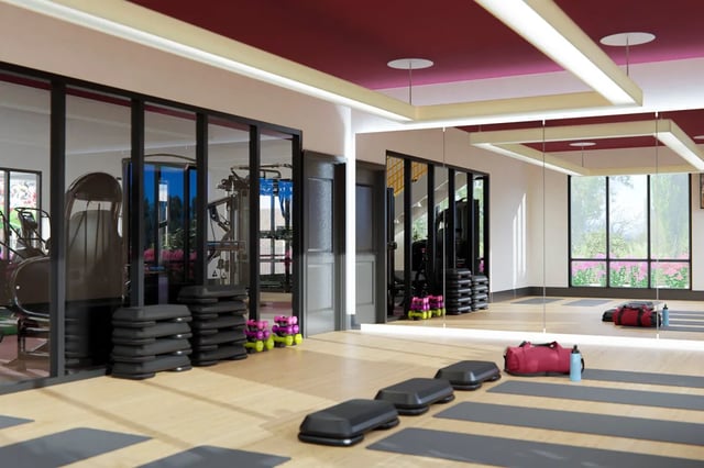 Dumbbells step platforms and exercise mats gym at The Landing at College Station in College Station Student Accommodation