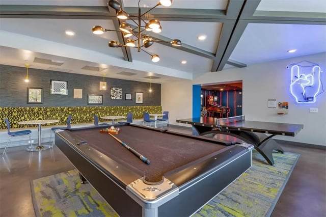 Pool table ping pong table arcade games recreation room at Rise At Riverfront Crossings in Iowa City Student Accommodation