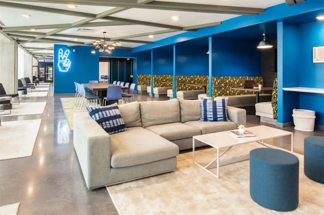 Large sectional couch coffee table and seating area Living room at Rise At Riverfront Crossings in Iowa City Student Accommodation