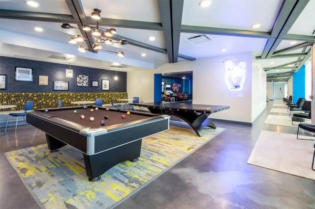 Pool table ping pong table arcade games lounge area at Rise At Riverfront Crossings in Iowa City Student Accommodation