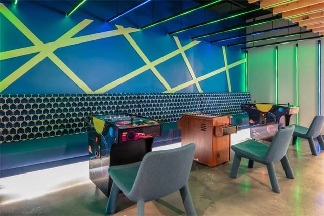 Arcade games and foosball table playing area at Rise At Riverfront Crossings in Iowa City Student Accommodation