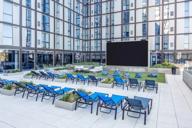 Loungers beanbags large screen exterior at Rise At Riverfront Crossings in Iowa City Student Accommodation