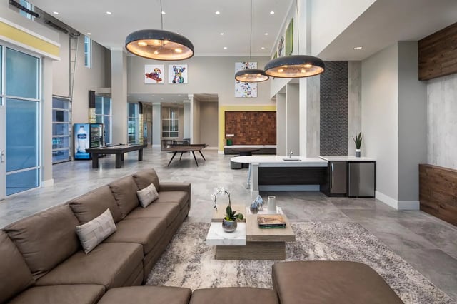 Sofa pool tables and bar counter common area at The Mark at Tucson in Tucson Student Accommodation