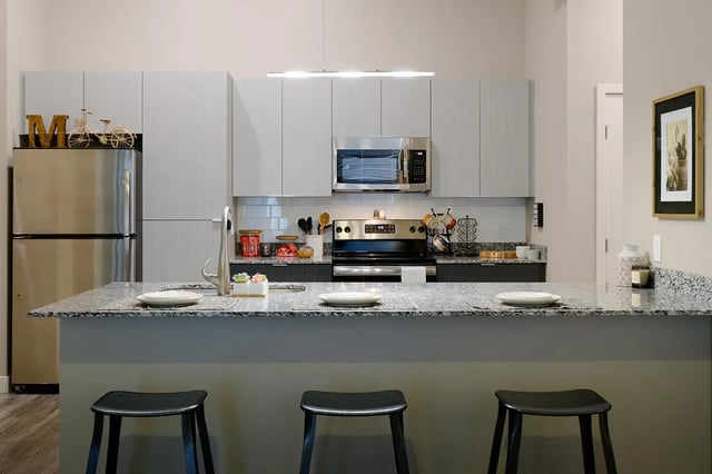 Refrigerator microwave stove sink stools counter kitchen at The Mark at Tucson in Tucson Student Accommodation