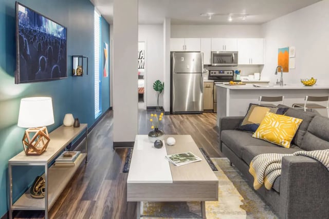 Sofa coffee table and kitchen living room at Rise On 9th in Columbia Student Accommodation