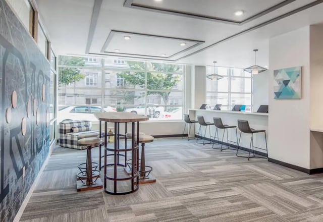 Study area with bar stools and table lounge area at Rise On Chauncey in West Lafayette Student Accommodation