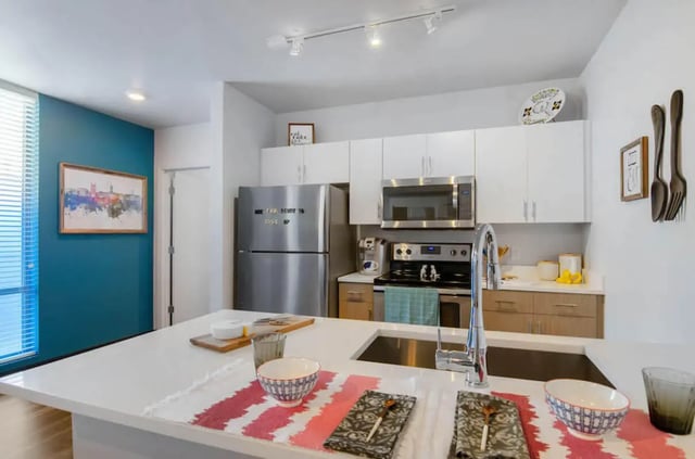 Modern kitchen island stainless steel appliances kitchen at Rise On Chauncey in West Lafayette Student Accommodation