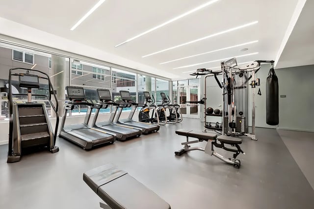 Treadmills elliptical and weight machines gym at Identity Davis Apartments in Davis Student Accommodation