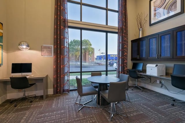 Computers printer chairs table study area at The Standard in St. Louis Student Accommodation