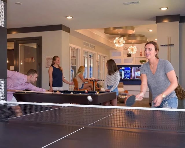 People playing ping pong and pool lounge at The Standard in St. Louis Student Accommodation