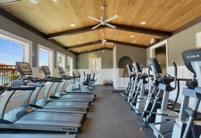 Treadmills elliptical machines ceiling fans gym at Tradition at 777 in Baton Rouge Student Accommodation
