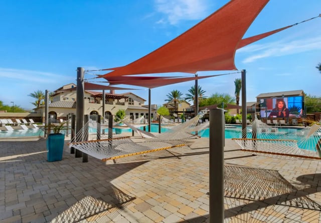 Hammocks by pool with outdoor screen exterior at Tradition at 777 in Baton Rouge Student Accommodation