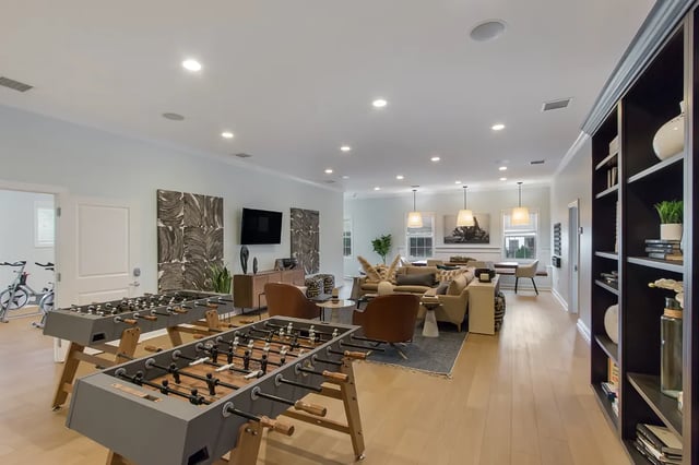 Foosball tables exercise bikes and lounge furniture living room at Ikon in Athens Student Accommodation