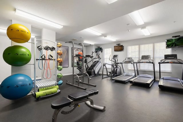 Fitness equipment balls resistance bands and treadmills gym at Irish Row in South Bend Student Accommodation