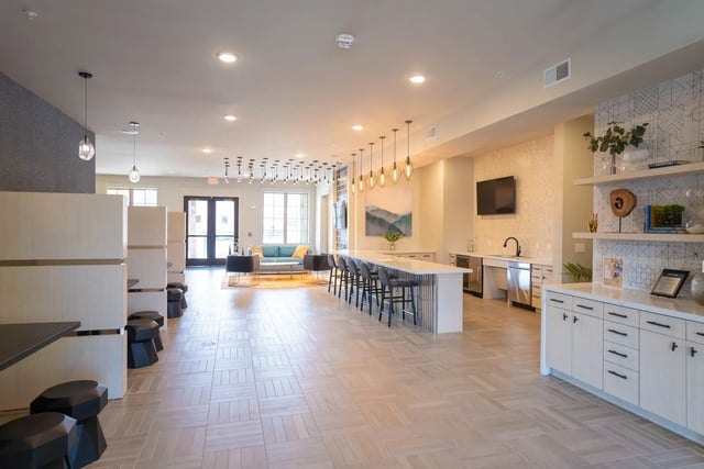 Kitchen island lounge seating and coffee bar at The Retreat at Illinois in Urbana Student Accommodation