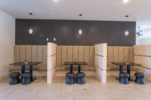 Booths with tables and stools study area at The Retreat at Illinois in Urbana Student Accommodation