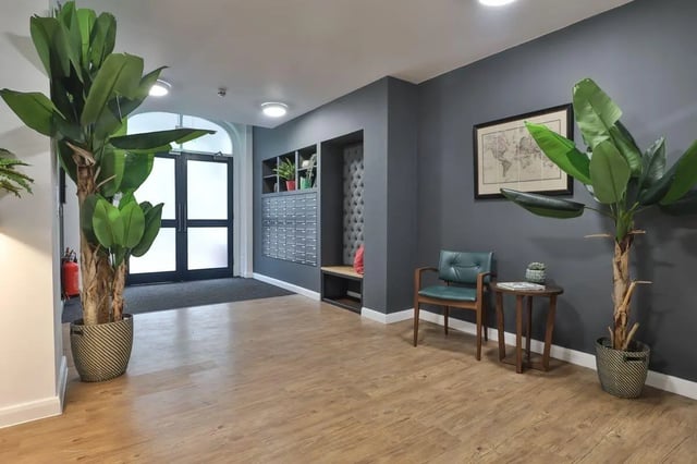 Plants mailboxes chair map and table entrance area at 140 New Walk Leicester in Leicester Student Accommodation