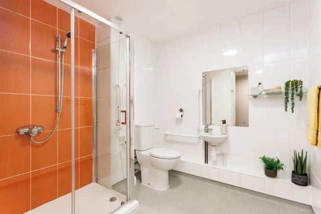 Shower toilet sink mirror plants bathroom at Sugarhouse in Edinburgh Student Accommodation