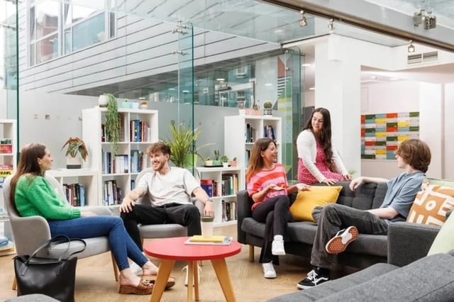 Students relaxing in a communal living room area at Sugarhouse in Edinburgh Student Accommodation