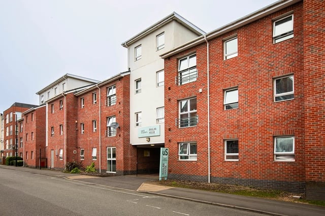 Red brick student accommodation with windows exterior at Raglan House in Coventry Student Accommodation