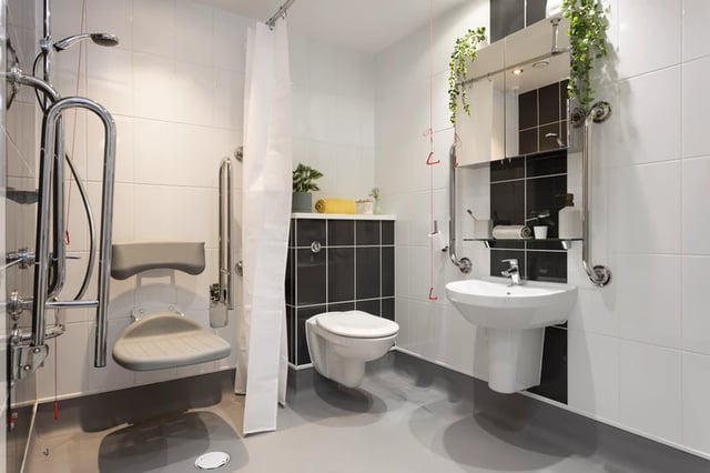 Shower seat toilet sink grab bars bathroom at Salisbury court in Edinburgh Student Accommodation