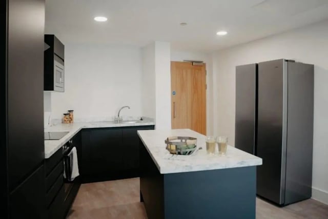Modern kitchen with dark cabinets and island kitchen at Volume Works in Birmingham Student Accommodation