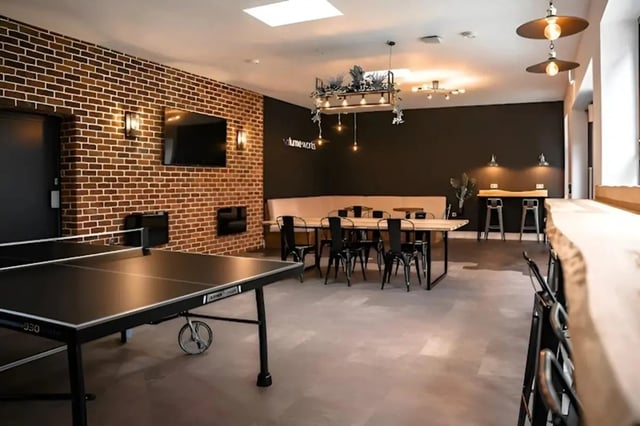 Ping pong table dining area and lounge living area at Volume Works in Birmingham Student Accommodation