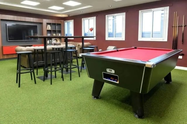 Pool table bar stools sofa television playing area at Wardley House in Bradford Student Accommodation