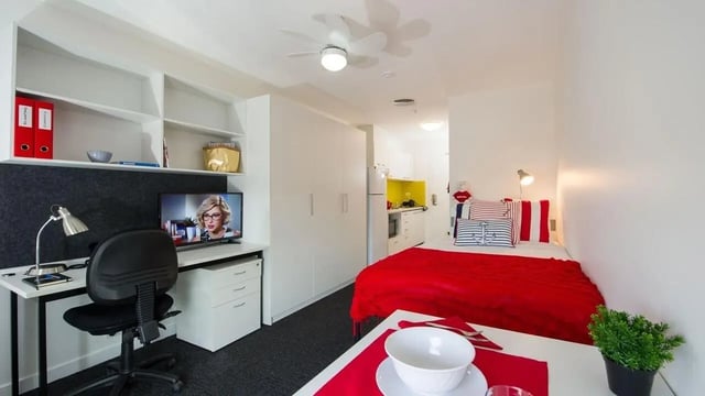 Desk chair tv shelving bed kitchen exterior at UniLodge Victoria University in Melbourne Student Accommodation