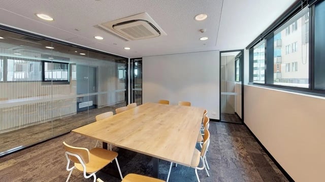 Large wooden table with chairs meeting room at UniLodge Lincoln House in Melbourne Student Accommodation