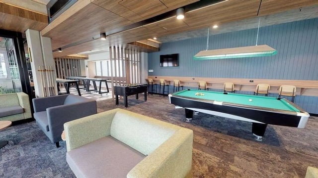 Pool table foosball table couches recreation area at UniLodge Lincoln House in Melbourne Student Accommodation