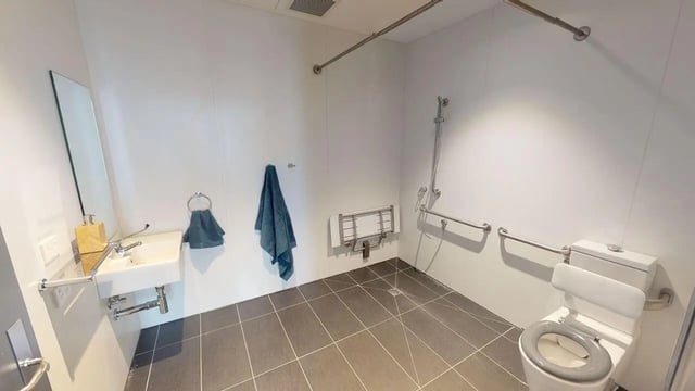 Sink toilet grab bars and shower seat bathroom at UniLodge Lincoln House in Melbourne Student Accommodation