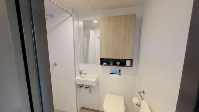 Sink toilet cabinet mirror shower Bathroom at UniLodge Lincoln House in Melbourne Student Accommodation