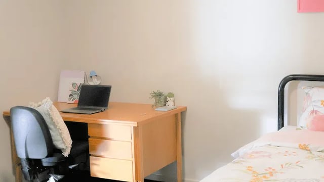 Desk with laptop and chair bedroom at La Trobe University - Terraces in Melbourne Student Accommodation