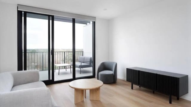 Sofa chairs table console living room at Dickson Village Apartments in Canberra Student Accommodation