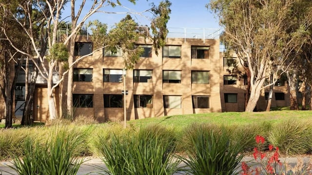 Brick building with many windows outdoor exterior at La Trobe University - Chisholm College in Melbourne Student Accommodation