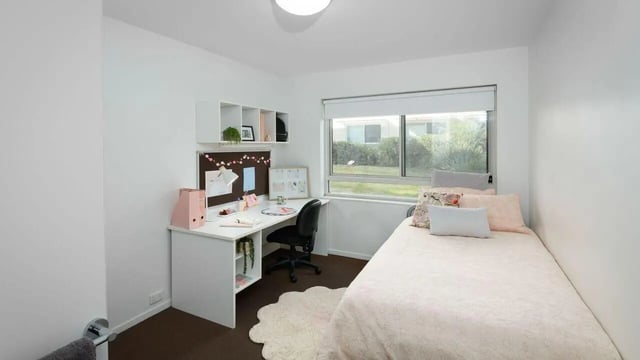 Desk bed and shelves bedroom at UniLodge @ UC - Campus West & Guginya in Canberra Student Accommodation