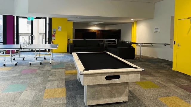 Pool table ping pong table sofas lounge area at Wellesley Apartments in Auckland Student Accommodation