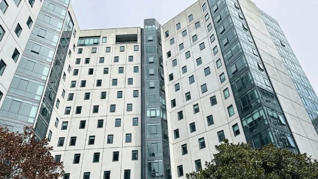 Modern building with many square windows exterior at Wellesley Apartments in Auckland Student Accommodation