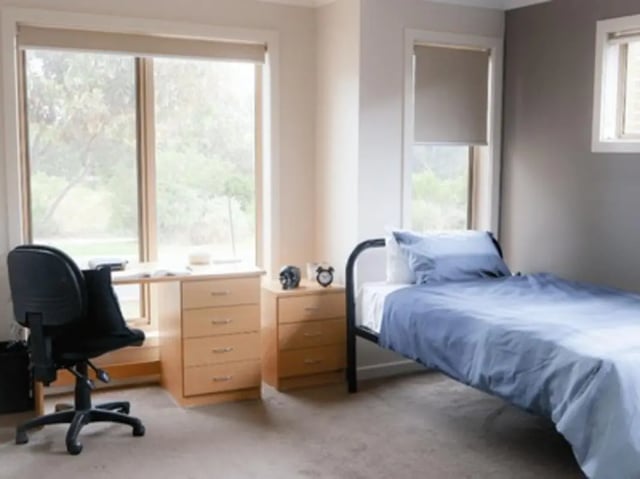 Bed desk chair nightstand dresser bedroom at La Trobe University Regional Housing - Melton in Melton Student Accommodation