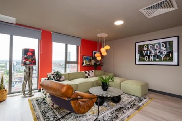 Stylish lounge with modern sectional sofa and artwork living room at Nelson Place in Belfast Student Accommodation