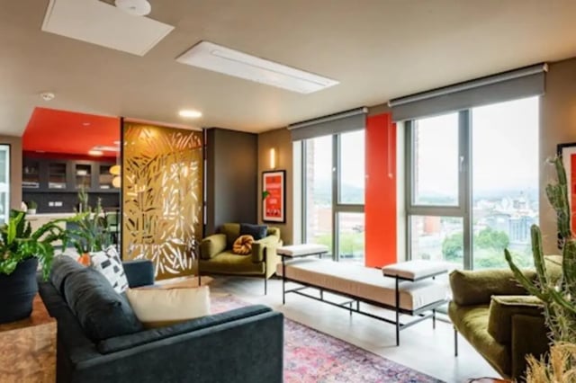 Modern living room with sofas and large windows living room at Nelson Place in Belfast Student Accommodation