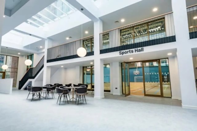 Tables chairs skylight sports hall interior at Nelson Place in Belfast Student Accommodation