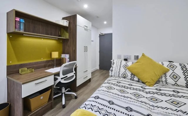Bed desk wardrobe with storage bedroom study area at The Oaks in Coventry Student Accommodation