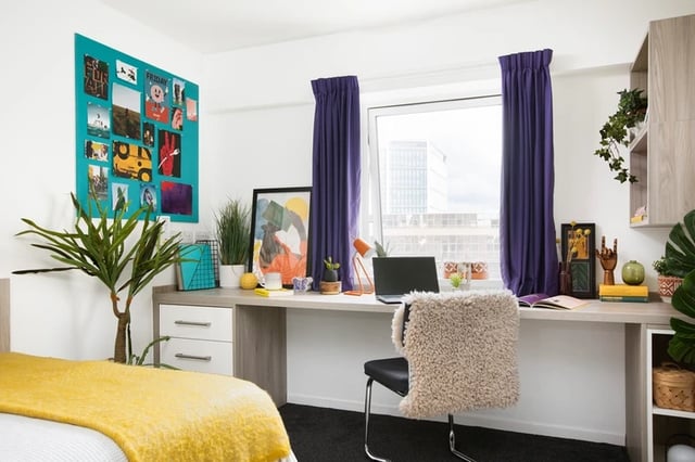 Desk plants artwork laptop chair bedroom at Ty Pont Haearn in Cardiff Student Accommodation